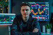 © photolas - A young man hosting a video blog session, engages with his audience about cryptocurrency trading, with dynamic digital charts displayed in the background.