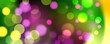 © FineVector - Mardi Gras festive background. Blurred bokeh lights and vibrant color gradients. Graphic template for Fat Tuesday celebration. Vector illustration.