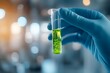 © milkyway - Gloved Hands Holding Test Tube With Green Vibrant Solution Symbolizing Scientific Discovery and