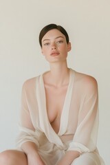Poster - Feminine Minimalist Portrait Graceful Woman in Sheer Beige Shawl - Soft Light for Modern Lifestyle Branding and Mental Health Campaigns