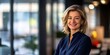 © CreativeSeven  - Empowered businesswoman using touchpad in modern office setting professional environment inspirational portrait