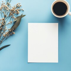 Leinwandbilder - Blank paper on a blue table with coffee and dried flowers for creative projects and notes. Generative AI