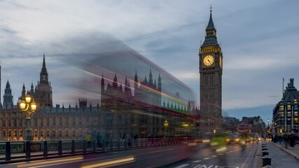 Wall Mural - Time lapse view of the illuminated Big Ben and Westminster Palace in London, England, during dusk with blurred street and pedestrian traffic