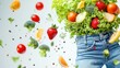 © Marta  Maksymiv - Green fruit, vegetables, smoothie falling into jeans on white background. Concept of weight loss, detox, diet, healthy clean nutrition