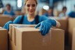 © Solid Tech - Close-up of unrecognizable volunteers packing donation boxes for charity. Generative AI