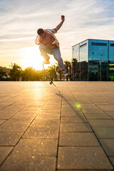 Wall Mural - Handsome young man portrait outdoors - Modern cool male wearing stylish urban clothing strolling in the city with skateboard