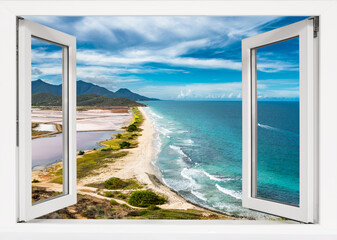 Wall Mural - Window with a view of the ocean and mountains