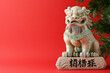 © jittam - Stone lion statue on red background, symbolizing protection and strength