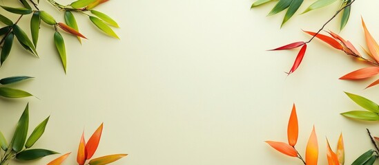 Poster - Vibrant Autumn Bamboo Arrangement with Multicolored Leaves on Soft Cream Background and Ample Empty Space for Text Overlay