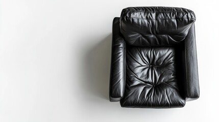 Wall Mural - Black leather armchair viewed from above on a white background with ample copy space for text insertion