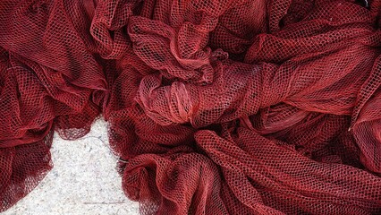 traditional red fishing net spread as background