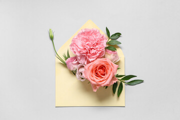 Canvas Print - Composition with envelope and beautiful flowers on grey background