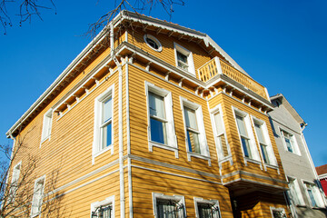 Wall Mural - historical ottoman period dark yellow wooden facade house in istanbul