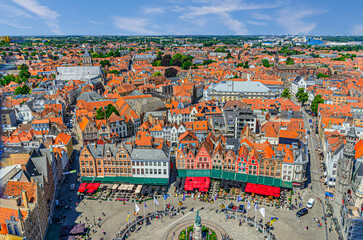 Wall Mural - Aerial panoramic view of Bruges historical city centre, Markt Market square, old buildings, traditional colourful Flemish style townhouses, skyline horizon panorama of Brugge old town, Belgium