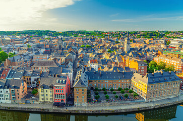 Wall Mural - Namur cityscape, aerial panoramic view of old town Namur city historical center with Sambre river embankment, skyline panorama of Namur with fields on horizon, Wallonia, Walloon Region, Belgium