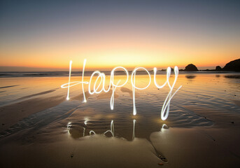 Poster - Light painting of happy words on beach at sunset with reflections and serene atmosphere