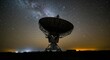 © Postmodern Studio - Large satellite dish is in the middle of a field