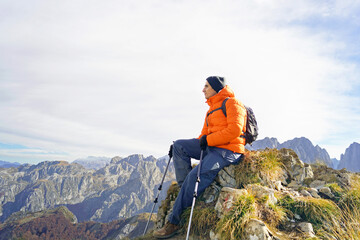 portrait of a tourist enjoying the view on the popadija peak in prokletije national park, montenegro