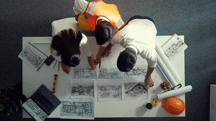 Poster - top down view of smart architect engineer place document at meeting table with safety helmet and pla