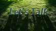 © Creative Habits - Text communication Let’s Talk conversation on grass with shadows for outdoor discussion