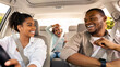 © Prostock-studio - Happy African American Family Riding New Automobile And Having Fun Singing Enjoying Road Trip On Vacation. Parents And Daughter Traveling By Car On Weekend. Selective Focus