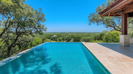 Poster - Tranquil infinity pool surrounded by lush greenery under a clear blue sky