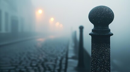 Poster - Dust pollution idea. A foggy street scene with cobblestones and illuminated lampposts at dusk.