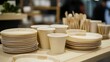 © Windi - Stacked eco-friendly disposable plates and cups.