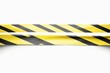 © Ayahe Stock - A yellow and black warning background with caution stripes, safety signs, and a construction design