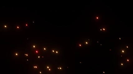 Wall Mural - burning embers glowing. fire glowing particles on black background