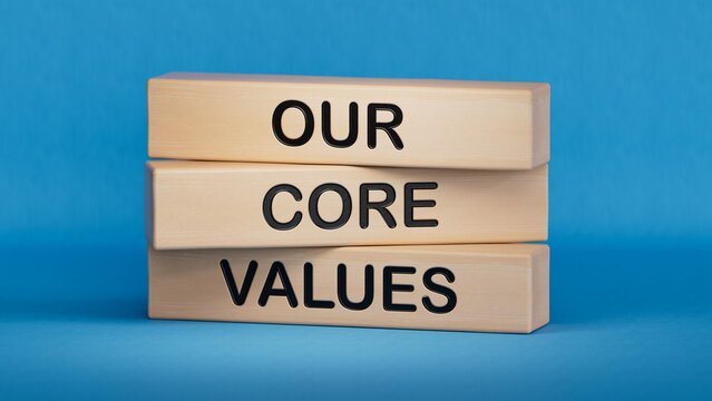 Our core values symbol. Concept words Our core values on wooden blocks.Business and Our core values concept. Copy space.3D rendering on blue background.