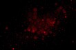 © neyostudio - Abstract red particles on a black background, creating a vibrant and dynamic visual effect.