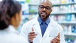 © Matthew - A pharmacist consulting with a patient in a pharmacy setting.