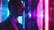 © KOSHKAROV SERGEI - Businessman immersed in vibrant neon lights of modern urban environment.