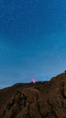 Wall Mural - magical night sky with stars, vertical time lapse view