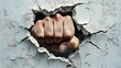 © Creative Design  - a fist punching through a hole in a wall