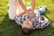 © New Africa - Woman doing cardiac massage to unconscious man with heart attack on green lawn