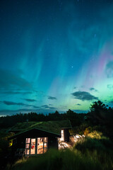 Wall Mural - Aurora Borealis over danish holiday home. High quality photo