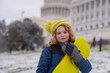© Volodymyr - Child play with snowboard sled in winter park. Kids with first snow. Child winter holiday. Smiling boy playing with snow in winter park. Portrait of a little kid in knit hat throw snowballs.