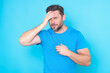 © Volodymyr - Millennial man having headache. Man in suffer from migraine or headache. Tired exhausted man suffering from headache. Terrible headache. Young man in shirt touching his head and keeping eyes.