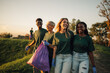© Zamrznuti tonovi - Volunteers carrying garbage bag enjoying teamwork cleaning park