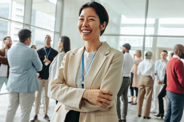 Wall Mural - happy korean businesswoman networking at a conference event