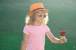 © Volodymyr - Valentines Day. Portrait of Valentines child with rose. Child smelling a flower. Valentines, Mother day, birthday celebration and love concept. Kids valentine romantic concept. Valentines day Concept.