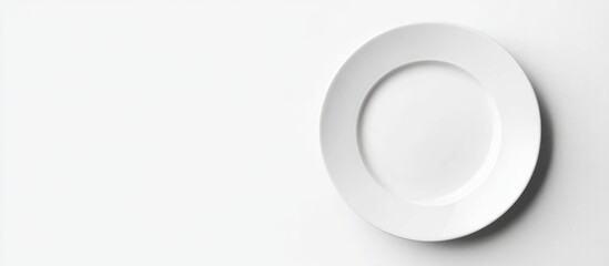 Poster - White empty plate on a white background with copy space for food presentation or restaurant branding