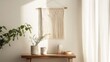 © VirtualVista - Home interior with macrame wall hanging, wooden table, potted plants, and natural light from window, featuring copy space for text.