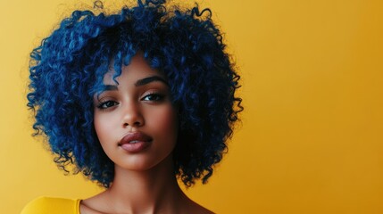 Young African female superhero with vibrant blue black curly hair on bright yellow background showcasing beauty and fantasy with space for text