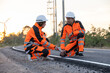 © Quality Stock Arts - Engineer worker wearing safety suite walking survey inspect new road build for final quality check