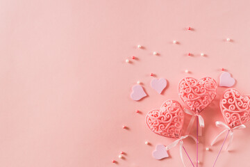 Wall Mural - Pink hearts on a light pink background