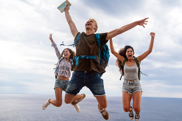 Wall Mural - group of backpacker friends with backpack traveling and enjoying the healthy lifestyle together
