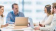 © Jo - Conference Room Meeting: Shows a team meeting around a table with a blurred background, emphasizing teamwork.